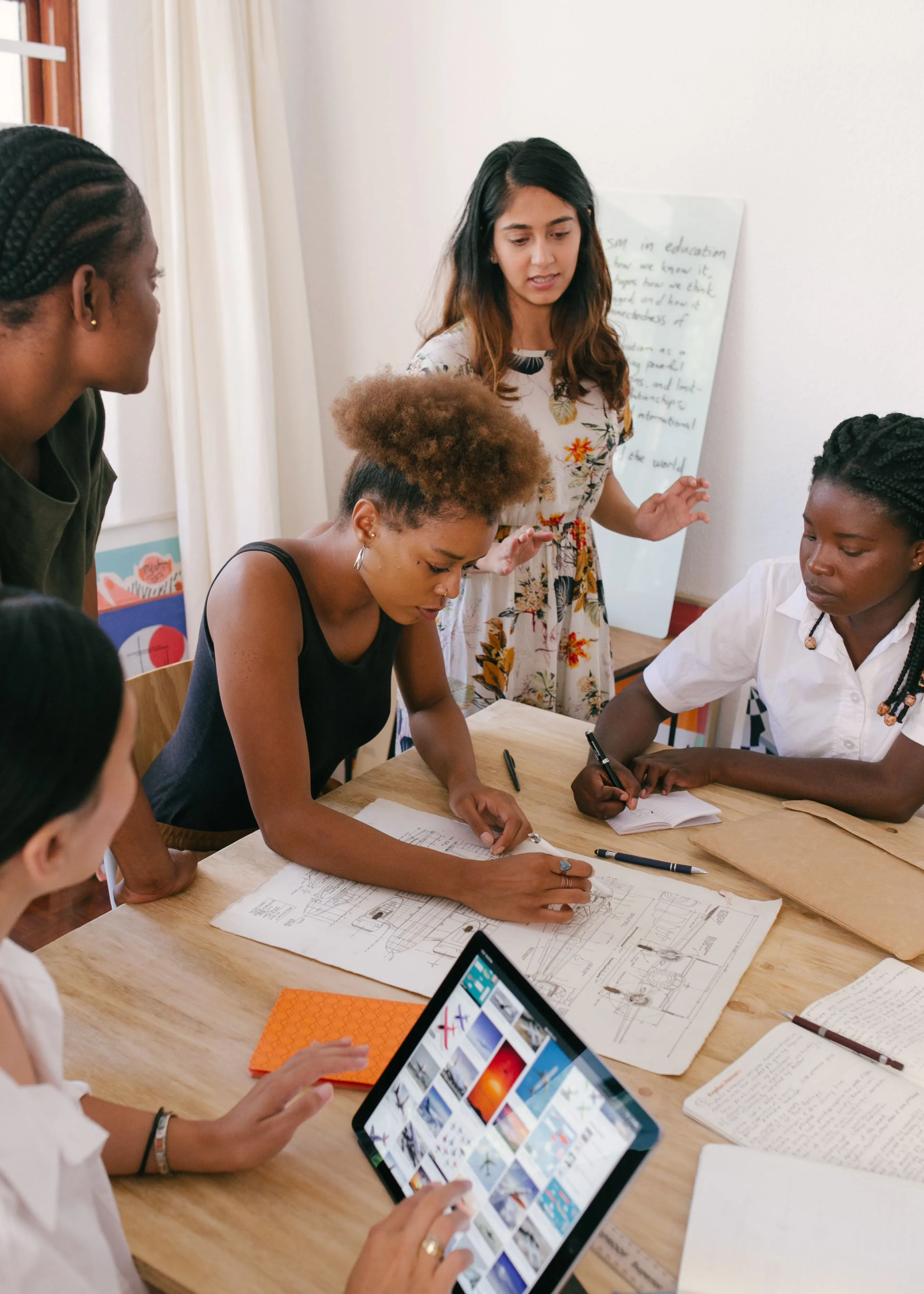 A community group planning a program together around a table